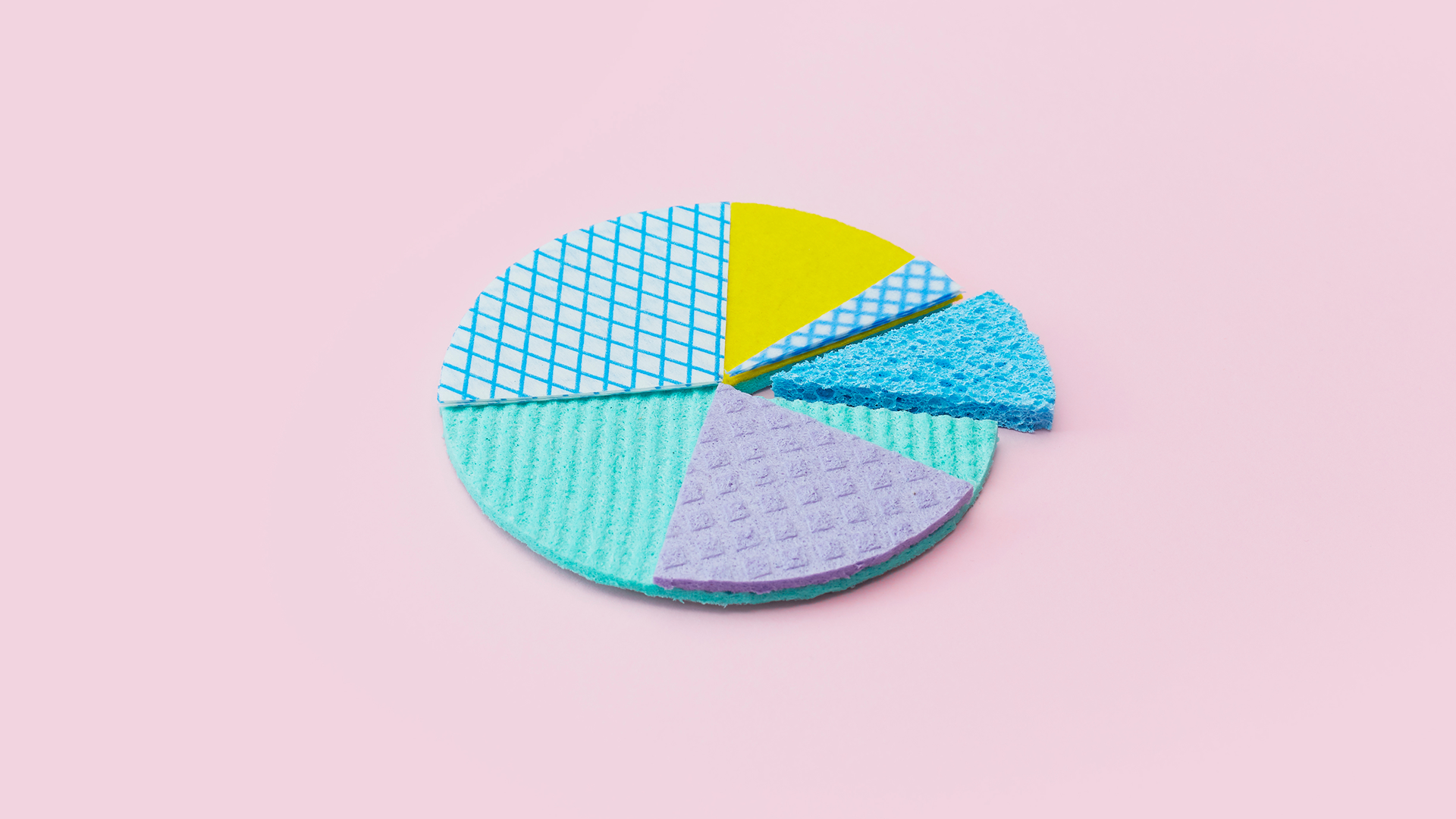 Multicolor pie chart on pink background